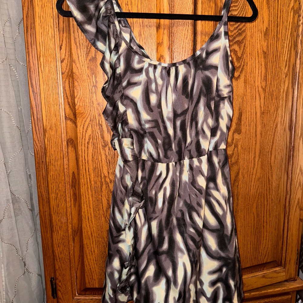 Envy Me one shoulder ruffle and other shoulder spaghetti strap.